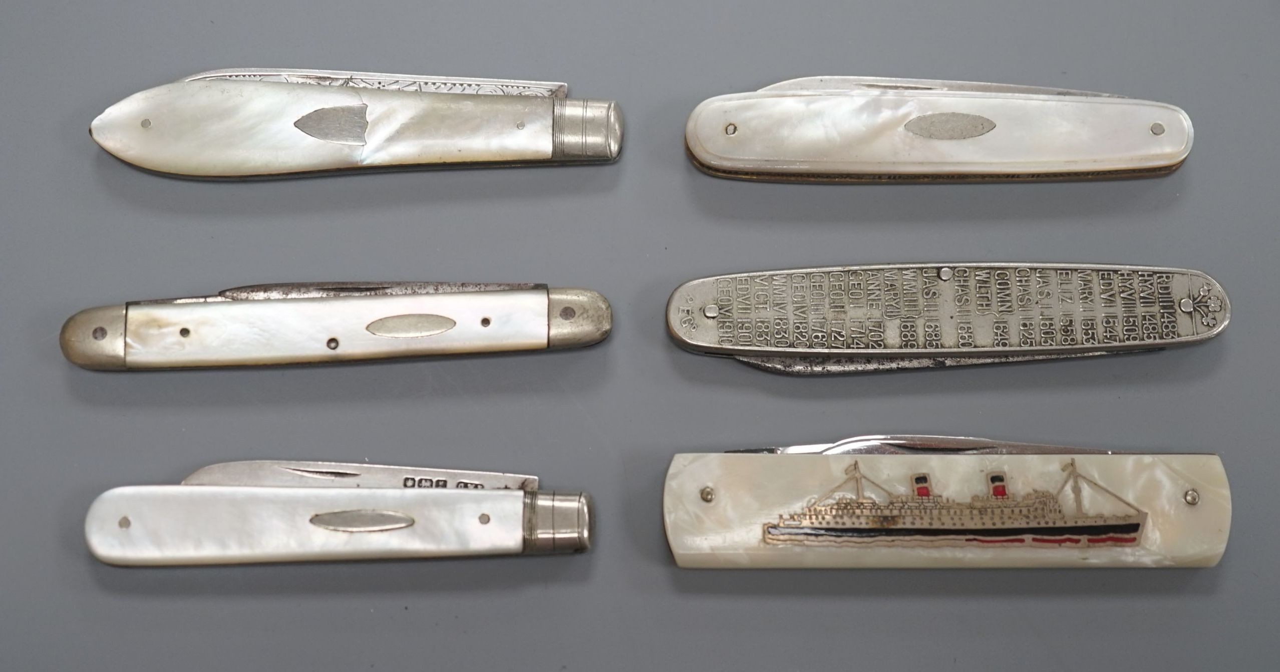 Three assorted mother of pearl mounted silver bladed fruit knives, one other penknife and two commemorative pocket knives.